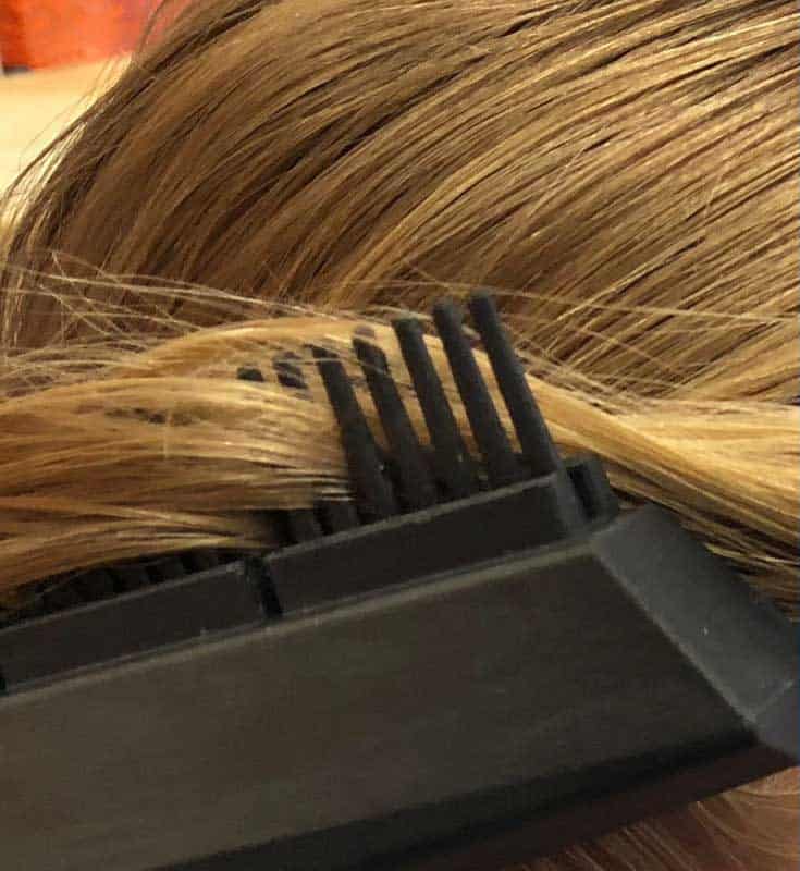 lice comb in woman's hair