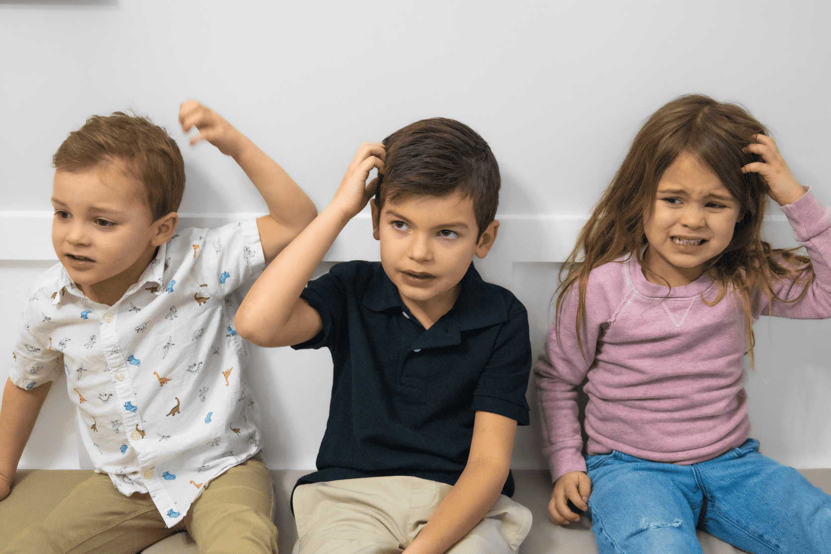 Kids have lice at school sitting in group waiting for heat treatment